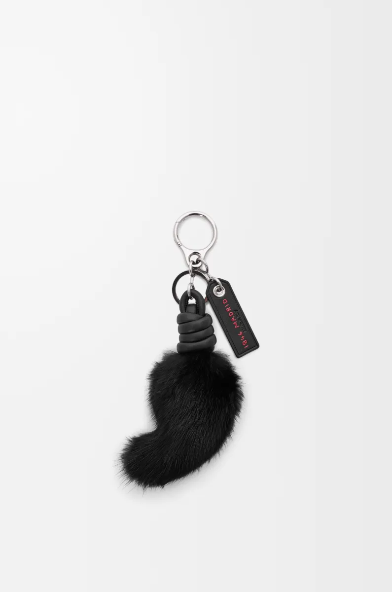 Lion tail charm in shearling and calfskin
