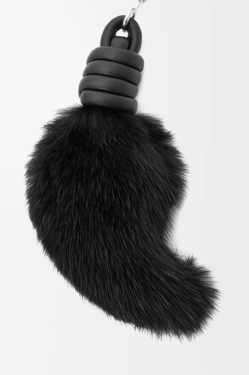 Lion tail charm in shearling and calfskin
