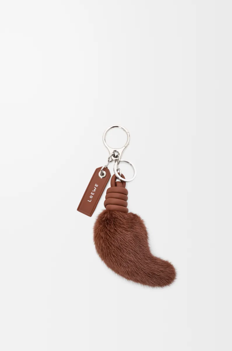 Lion tail charm in shearling and calfskin