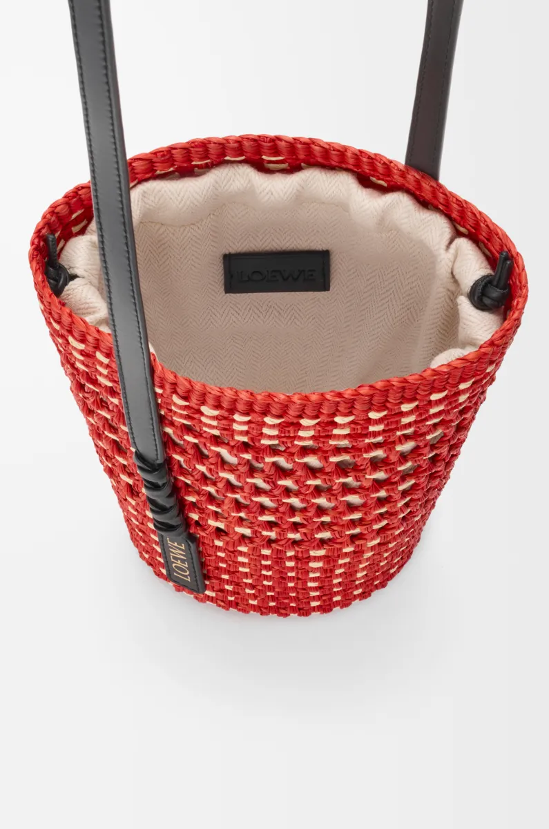 Braid pocket in iraca palm and calfskin