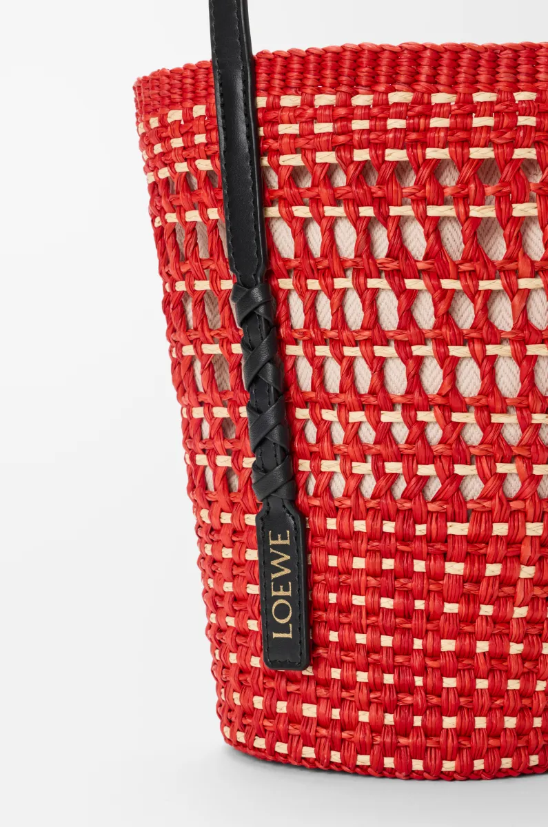 Braid pocket in iraca palm and calfskin